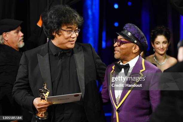 In this handout photo provided by A.M.P.A.S. Best Director award winner Bong Joon Ho and Spike Lee stand backstage during the 92nd Annual Academy...