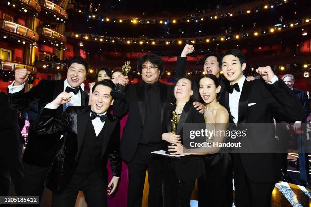 In this handout photo provided by A.M.P.A.S. Best Picture Award winners for "Parasite" pose onstage during the 92nd Annual Academy Awards at the...