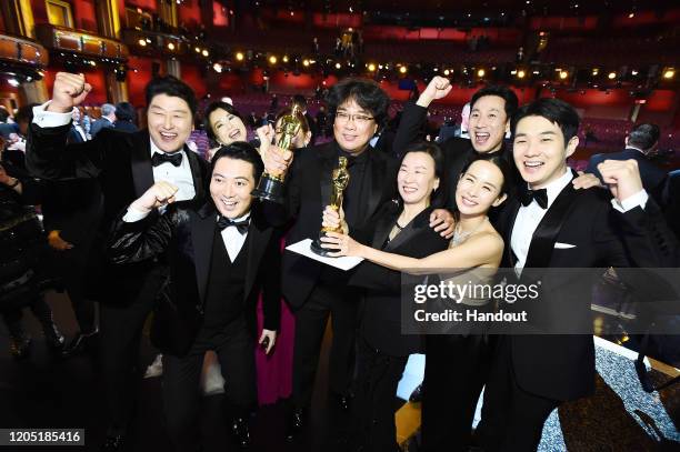 In this handout photo provided by A.M.P.A.S. Best Picture Award winners for "Parasite" pose onstage during the 92nd Annual Academy Awards at the...