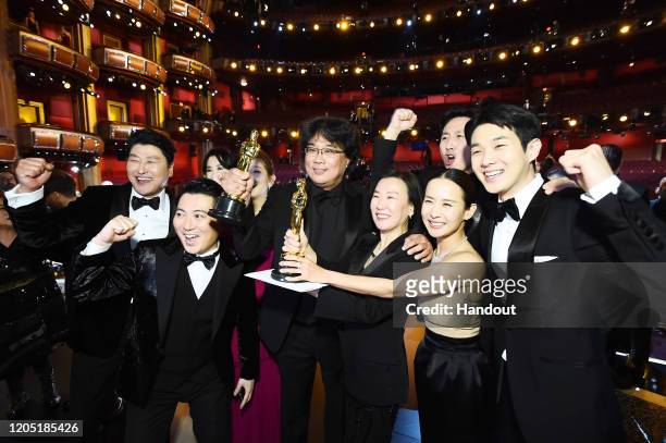 In this handout photo provided by A.M.P.A.S. Best Picture Award winners for "Parasite" pose onstage during the 92nd Annual Academy Awards at the...