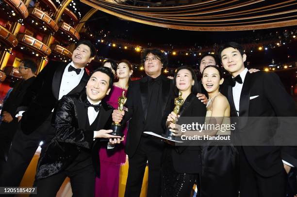 In this handout photo provided by A.M.P.A.S. Best Picture Award winners for "Parasite" pose onstage during the 92nd Annual Academy Awards at the...