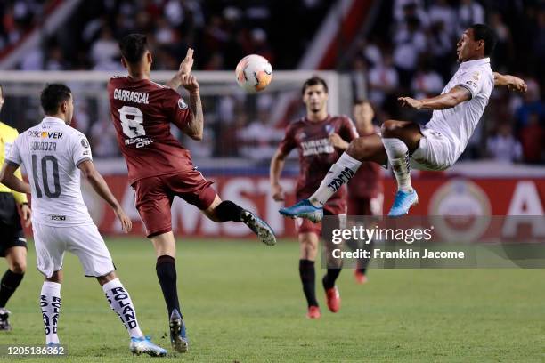 Jose Quintero of Liga de Quito kicks the ball in the air against Jorge Carrascal of River Plate during a Group D match between Liga Deportiva...