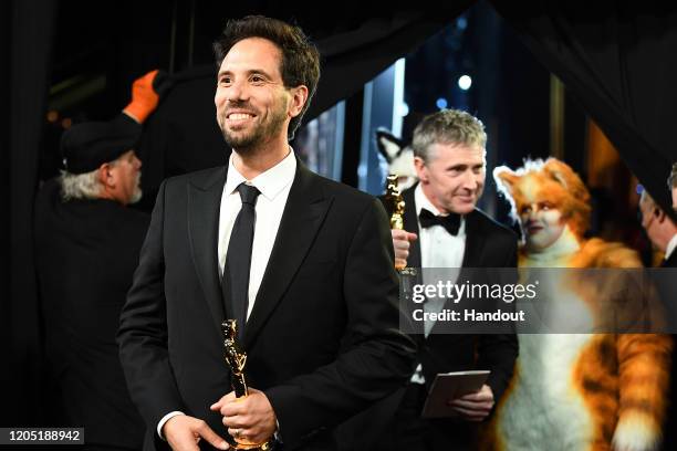 In this handout photo provided by A.M.P.A.S. Visual Effects award winners Guillaume Rocheron and Dominic Tuohy walk backstage during the 92nd Annual...