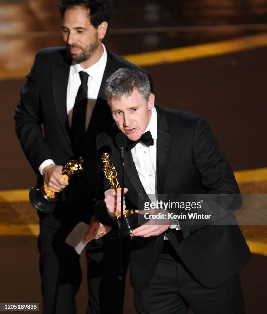 Guillaume Rocheron and Dominic Tuohy accept the Visual Effects award for '1917' onstage during the 92nd Annual Academy Awards at Dolby Theatre on...