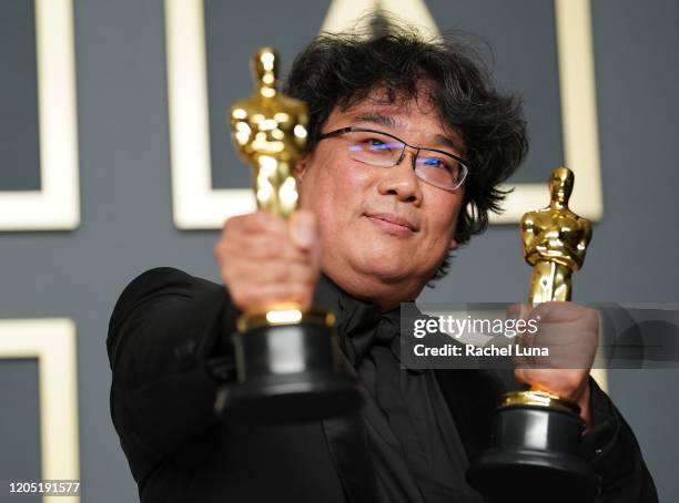 Bong Joon-ho, winner of the Original Screenplay, International Feature Film, Directing, and Best Picture award for “Parasite,” poses in the press...