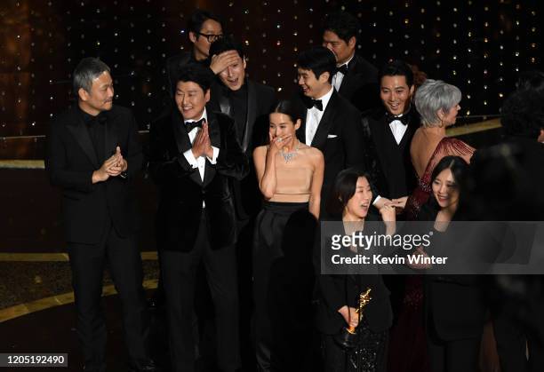 Kang-ho Song, Lee Sun-kyun, Cho Yeo-jeong, Choi Woo-shik, Kwak Sin-ae, and Park Myung-hoon accept the Best Picture award for 'Parasite' with...