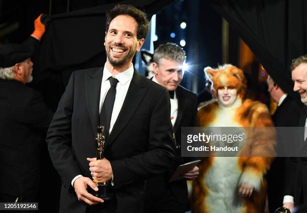 In this handout photo provided by A.M.P.A.S. Visual Effects award winners Guillaume Rocheron and Dominic Tuohy walk backstage during the 92nd Annual...
