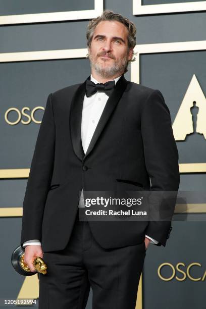 Joaquin Phoenix, winner of the Actor in a Leading Role award for "Joker," poses in the press room during the 92nd Annual Academy Awards at Hollywood...