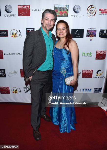 Actor Jeremy Miller and Joanie Miller attend the 5th Annual Roger Neal and Maryanne Lai Oscar Viewing Dinner-Icon Awards and After Party at The...
