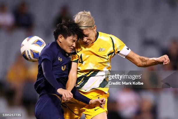 Natthakarn Chinwong of Thailand and Alanna Kennedy of the Matildas collide as they compete for the ball during the Women's Olympic Football...