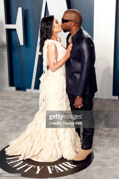 Kim Kardashian West and Kanye West kiss at the 2020 Vanity Fair Oscar Party at Wallis Annenberg Center for the Performing Arts on February 09, 2020...