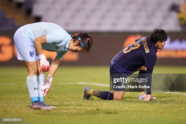 Tiffany Sornpao and Natthakarn Chinwong of Thailand look dejected during the Women's Olympic Football Tournament Qualifier match between Thailand and...