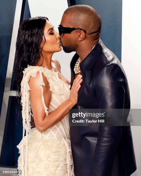 Kim Kardashian West and Kanye West kiss at the 2020 Vanity Fair Oscar Party at Wallis Annenberg Center for the Performing Arts on February 09, 2020...