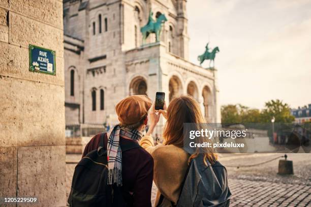 we should post this on social media - couple paris stock pictures, royalty-free photos & images