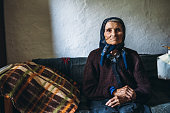 90 year old woman sitting on bed