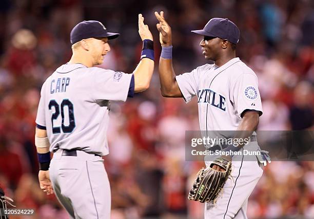 Trayvon Robinson and Mike Carp of the Seattle Mariners celebrate after the game with the Los Angeles Angels of Anaheim on August 6, 2011 at Angel...