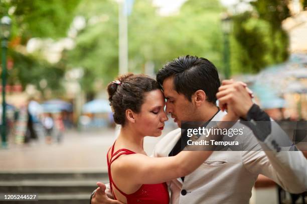 close up view of tango dancers head to head. - buenos aires tango stock pictures, royalty-free photos & images