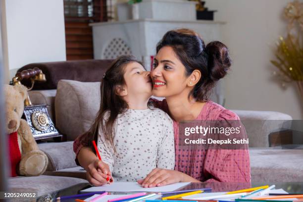 girl painting drawing with her mother stock photo - indian mother and child stock pictures, royalty-free photos & images