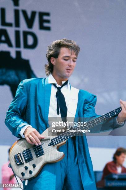 Bassist Martin Kemp performing with English pop group Spandau Ballet at the Live Aid concert at Wembley Stadium, London, 13th July 1985.