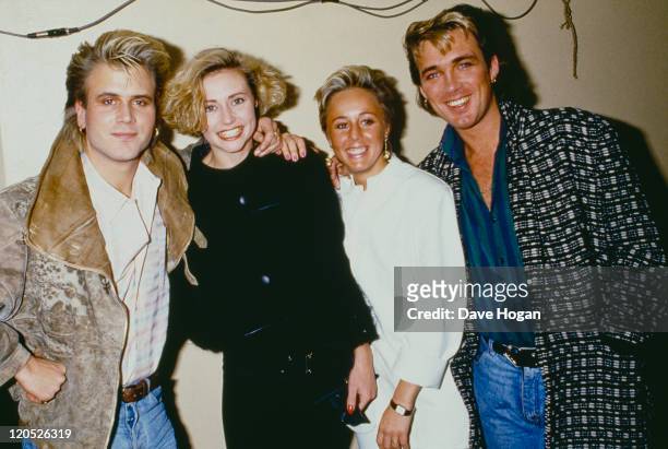 Saxophonist Steve Norman and bassist Martin Kemp of British pop group Spandau Ballet, 1985. Kemp is with his wife, singer Shirlie Holliman of Pepsi &...