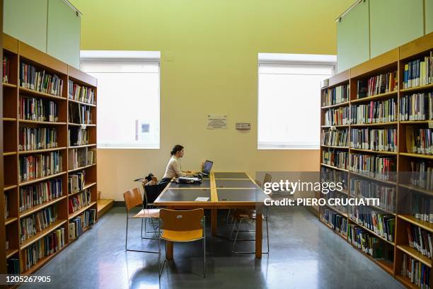 Student studies alone at the library of the University Milano-Bicocca in Milan, on March 5, 2020. - Italy closed all schools and universities until...