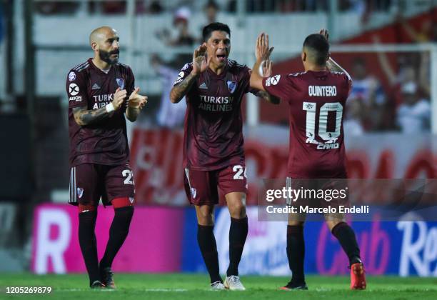 Javier Pinola , Enzo Perez and Juan Fernando Quintero celebrate after winning a match between Union and River Plate as part of Superliga 2019/20 at...