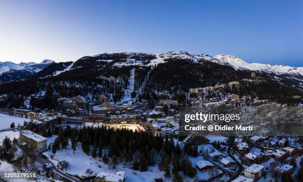 blue hour over the famous crans-montana village in switzerland - crans montana stock-fotos und bilder