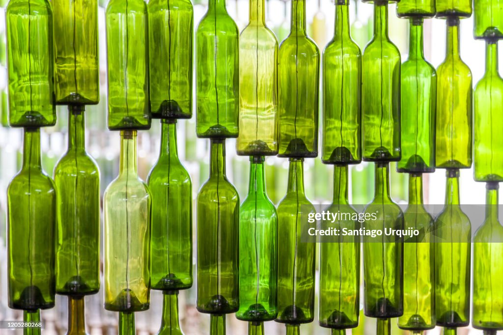 Wall of recycled glass bottles