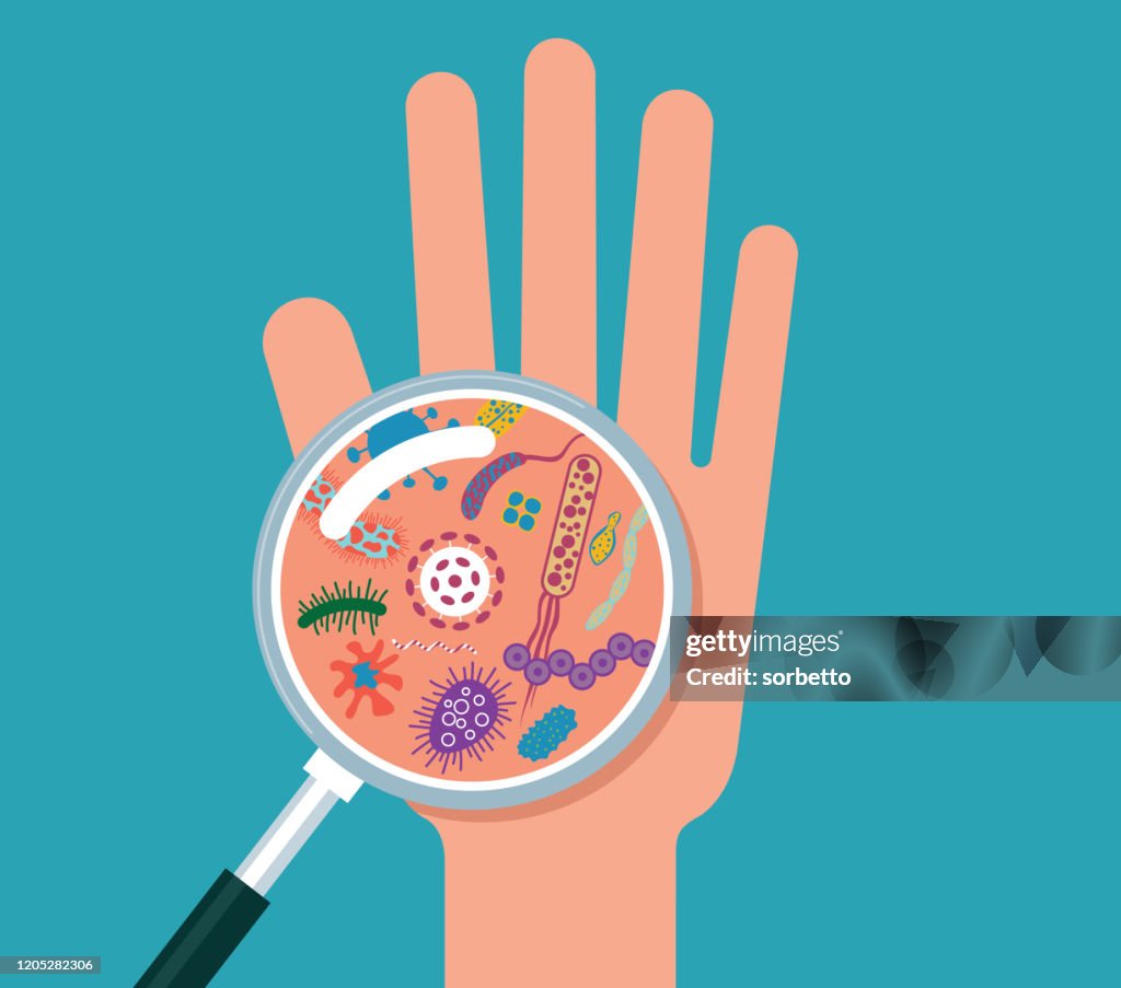 Magnifier and bacterial cells on human palm