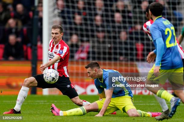 Daniel Schwaab of PSV, Robert Bozenik of Feyenoord during the Dutch Eredivisie match between PSV v Feyenoord at the Philips Stadium on March 1, 2020...