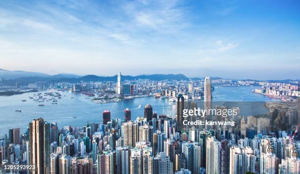 hong kong skyline china - east asia skyscraper cityscape day victoria harbour - hong kong ship sunset futuristic island architecture asia blue city cloud - sky cloudscape development district downtown dusk famous place harbour hong kong island horizontal - hongkong stock pictures, royalty-free photos & images