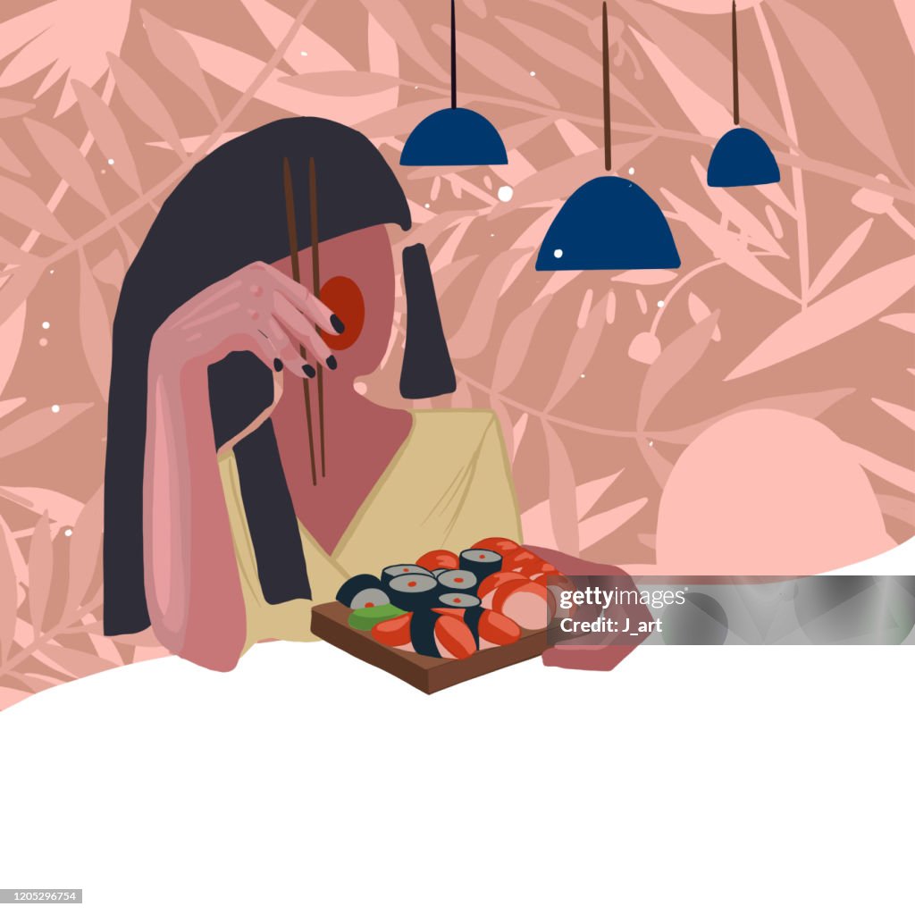 Girl with ruby chicks eating sushi in the restaurant. Floral background.