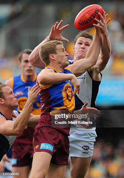 Luke Power of the Lions spoils the mark during the round 20 AFL match between the Brisbane Lions and the Adelaide Crows at The Gabba on August 7,...