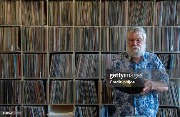 record collector in front of his collection - collections stock pictures, royalty-free photos & images