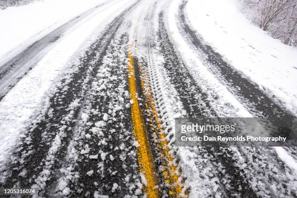 extreme weather - road in snow - snowy road stock pictures, royalty-free photos & images