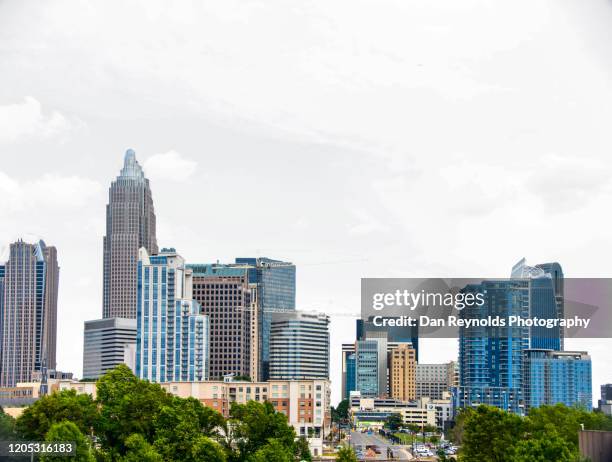 buildings in city against clear sky - charlotte north carolina neighborhood stock pictures, royalty-free photos & images