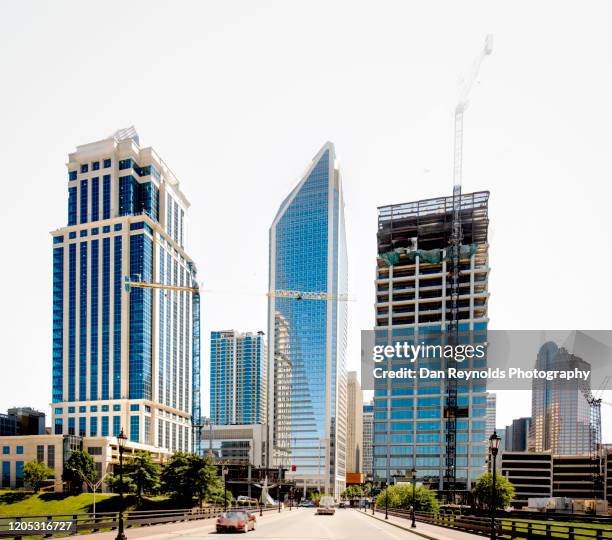 buildings in city against clear sky - charlotte north carolina landmarks stock pictures, royalty-free photos & images