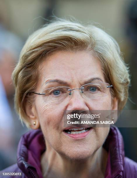 Democratic presidential candidate Massachusetts Senator Elizabeth Warren announces the suspension of her presidential campaign in front of her...