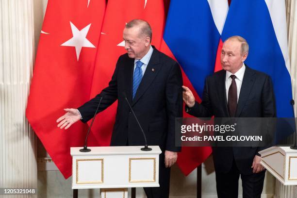 Russian President Vladimir Putin and his Turkish counterpart Recep Tayyip Erdogan leave after holding a joint press statement following their talks...