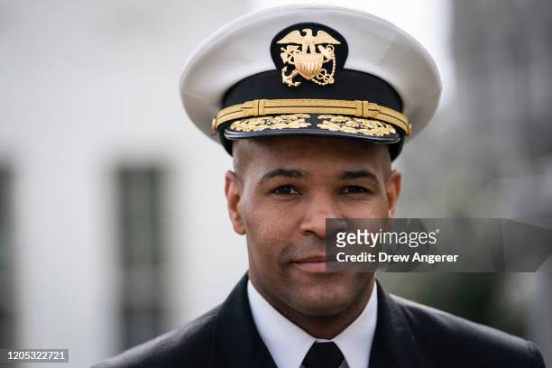 Surgeon General Jerome Adams walks outside the West Wing of the White House on his way to do a television interview with Fox News on March 5, 2020 in...