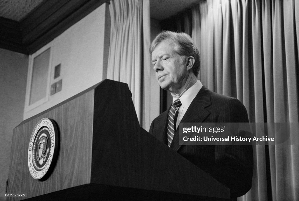 US President Jimmy Carter announces new sanctions against Iran in retaliation for taking US Hostages, Washington
