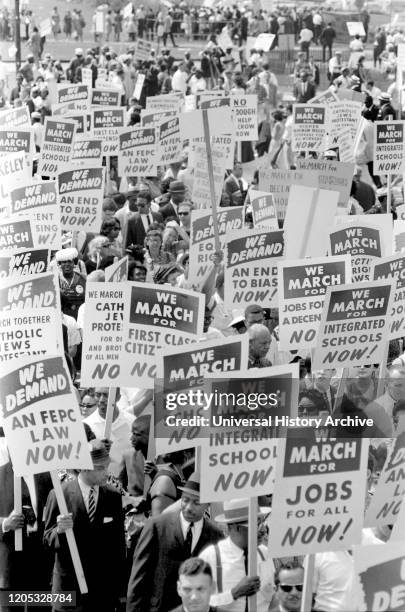 Demonstrators marching in Street holding Signs during March on Washington for Jobs and Freedom, Washington, D.C., USA, photograph by Marion S....