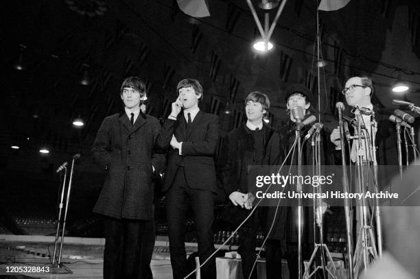 Arrival and Press Conference of the British Rock and Roll Band The Beatles, Washington, D.C., USA, photograph by Marion S. Trikosko, February 11,...