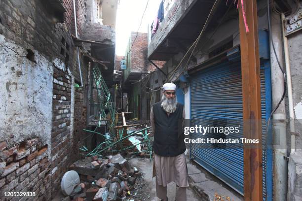 Resident passes by a burnt house after communal violence in northeast Delhi last week over the Citizenship Amendment Act , at Shiv Vihar on March 5,...