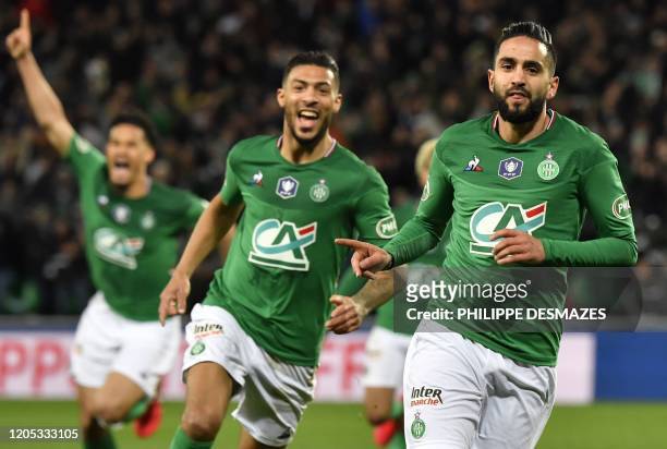 Saint-Etienne's Algerian midfielder Ryad Boudebouz celebrates after scoring a goal next to Saint-Etienne's Gabonese forward Denis Bouanga during the...