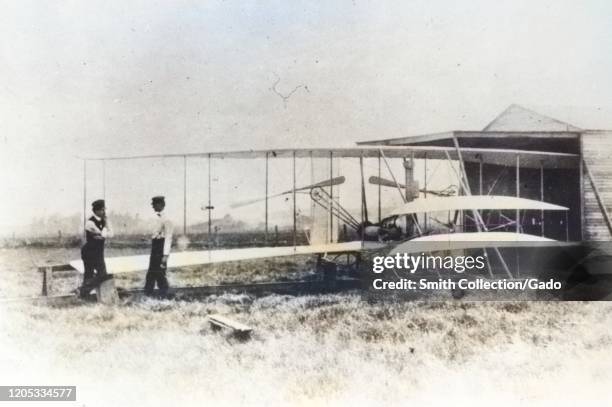 Brothers Wilbur and Orville Wright with the Flyer II at Huffman Prairie, outside of Dayton, Ohio, May, 1904. Image courtesy National Aeronautics and...