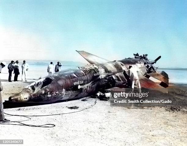 Air Force team gathered around X-15 rocket-powered aircraft crash at Mud Lake, Nevada, November 9, 1962. Image courtesy National Aeronautics and...