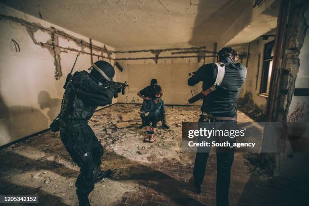 detective saving a hostage - kidnapping stock pictures, royalty-free photos & images