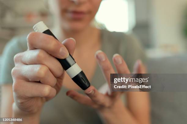 Finger Sticker Diabetes Diabetes Finger Stick Photos and Premium High Res Pictures - Getty Images