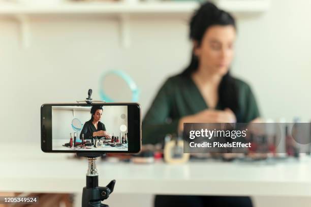 woman vlogging about make-up - social media marketing stock pictures, royalty-free photos & images